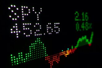 a close up of a clock with different colored numbers